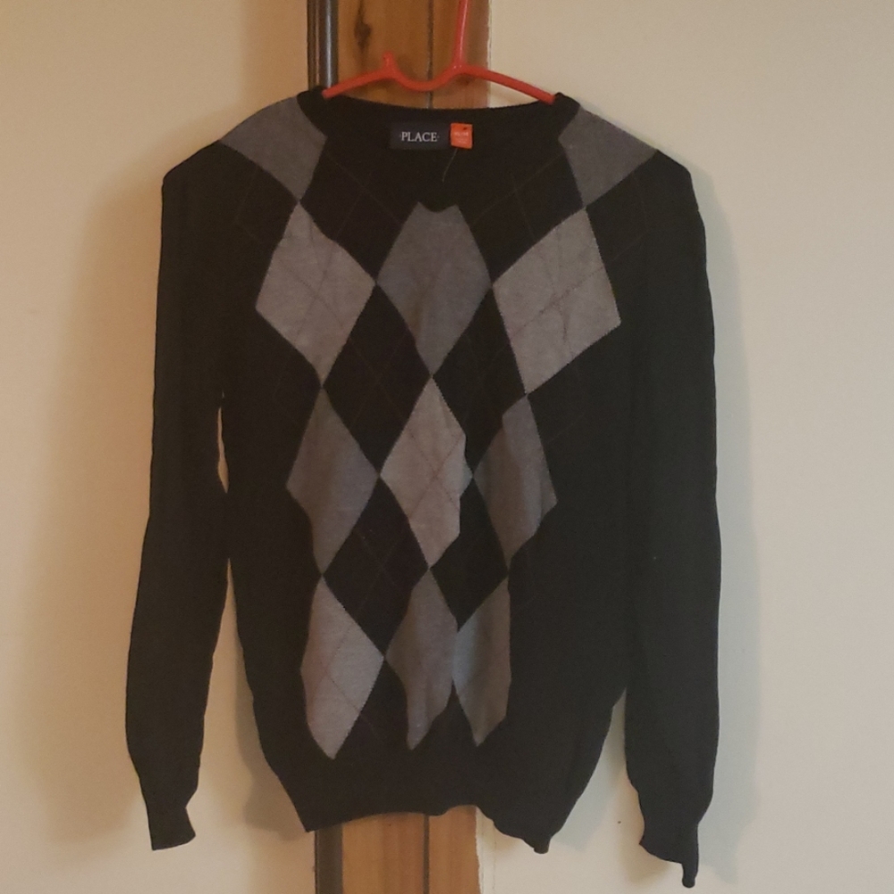 Children place sweater